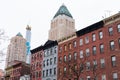 Row of Colorful Old Brick Buildings with Skyscrapers in the Background in Hell`s Kitchen of New York City Royalty Free Stock Photo