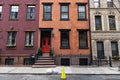 Row of Colorful Old Brick Residential Buildings along a Sidewalk in Greenwich Village of New York City Royalty Free Stock Photo