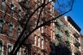 Row of Colorful Old Brick Residential Buildings with Fire Escapes in Greenwich Village of New York City Royalty Free Stock Photo