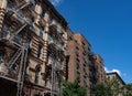 Row of Colorful Old Brick Residential Buildings with Fire Escapes in Greenwich Village of New York City Royalty Free Stock Photo