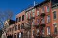 Row of Colorful Old Brick Residential Buildings with Fire Escapes in Williamsburg Brooklyn of New York City