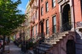 Row of Colorful Old Homes in Greenpoint Brooklyn New York along the Sidewalk Royalty Free Stock Photo