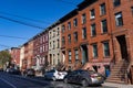 Row of Colorful Old Brick Residential Buildings in Williamsburg Brooklyn along a Neighborhood Street Royalty Free Stock Photo