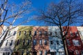 Row of Colorful Old Brick and Wood Residential Buildings in Greenpoint Brooklyn New York along a Street with Parked Cars Royalty Free Stock Photo