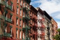 Row of Colorful Old Residential Buildings with Fire Escapes on the Lower East Side of New York City Royalty Free Stock Photo