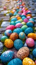 A row of colorful painted eggs sitting on a stone path Royalty Free Stock Photo