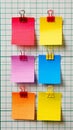 A row of colorful paper clips with different colored papers attached, AI Royalty Free Stock Photo