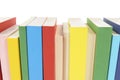 Row of books, spine view, multicolor, white background Royalty Free Stock Photo