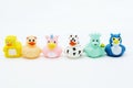 A row of colorful rubber ducks on an isolated white background Royalty Free Stock Photo