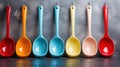 A row of colorful spoons hanging from a hook on the wall, AI Royalty Free Stock Photo