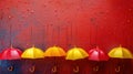 Row of Colorful Umbrellas Hanging on Red Wall Royalty Free Stock Photo