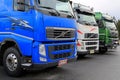 Row of Colorful Volvo Trucks Royalty Free Stock Photo