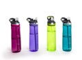 A row of colorful water bottles filled with water. Isolated on a white background.