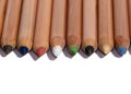 Row of colorful wooden pencils isolated on a white background Royalty Free Stock Photo