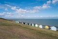 A row of colourful beach huts along the sea front in Tankerton, Whitstable Royalty Free Stock Photo