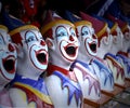 Row of Colourful Carnival Clown Heads Game Royalty Free Stock Photo