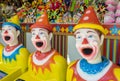 Row of colourful clowns at funfair Royalty Free Stock Photo