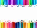 A vibrant row of colourful pencils with a white background Royalty Free Stock Photo