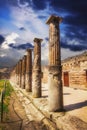 A row of columns in the ruins of the ancient town of Pompeii Royalty Free Stock Photo