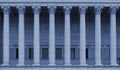 A row of corinthian columns of a public law court in Lyon, France - blue color tone