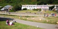 Row of Cottages with a Green In Front