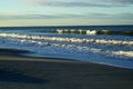 Row of cresting waves at sunrise gulf of mexico