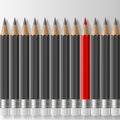 Row of dark grey pencils with one outstanding red