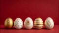 A row of decorated Easter eggs on a red background with various patterns and designs Royalty Free Stock Photo