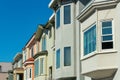 Row of decorative house facades or home exteriors in historic districts of San Francisco California neighborhood