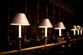 Row of decorative table lamps illuminating in a church