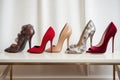 row of designer shoes by top designers, including casadei and manolo blahnik
