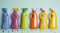Row of different colored spray bottles on a white surface. Perfect for product photography Royalty Free Stock Photo