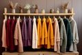 Row of different colorful Knitted warm sweaters hang, Rack with stylish women\'s clothes autumn colored. Clothes for Royalty Free Stock Photo