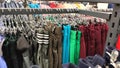 Row of different colorful pants trousers on hanger in shop, Royalty Free Stock Photo