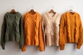 Row of different stylish fashion knitted jackets coat winter clothes