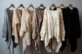 Row of different stylish fashion knitted jackets coat winter clothes