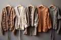 Row of different stylish fashion knitted jackets coat winter clothes