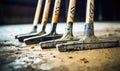 A Lineup of Dusty Baseball Bats Overlooking a Grassy Diamond Royalty Free Stock Photo