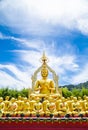 Row of disciple statues surrounding big buddha statue Royalty Free Stock Photo