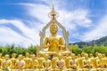 Row of disciple statues surrounding big buddha statue in public to the general public worship worship, Thailand