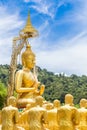 Row of disciple statues surrounding big buddha statue in public to the general public worship worship