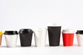 Row of disposable coffe cups.