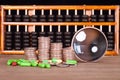 A row of dollar coins, a magnifying glass and capsule medicines scattered on the table in front of a dark background Royalty Free Stock Photo