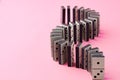 Row of domino tiles on pink studio background close up Royalty Free Stock Photo