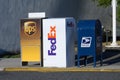 Row of drop boxes for UPS, FedEx, and USPS Royalty Free Stock Photo