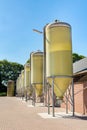 Row of dutch feed silos at cattle shed Royalty Free Stock Photo