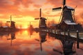row of dutch windmills at sunset with reflections Royalty Free Stock Photo