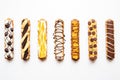 row of eclairs with different chocolate patterns