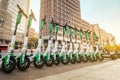 Row of electric E scooters , escooter or e-scooter of the company LIME