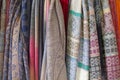 Row of elegant cashmere scarves for sale